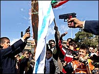 Burning shooting Israeli flag