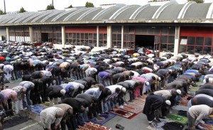 Muslims overflow outside prayers at a former fire brigade in Paris. (Photo by Reuters)