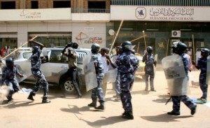 police used tear gas and batons against people gathered in a street in east Khartoum