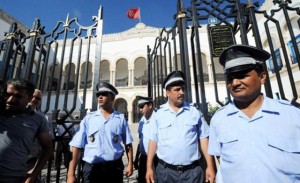 Security forces stand guard outside Nessma TV