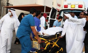 Rescue workers attend to victims of a fire that broke out a school in Jeddah