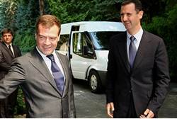 Russian Dmitry Medvedev and Syrian Bashar al-Assad