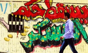 graffiti which reads “Down with the military rule”