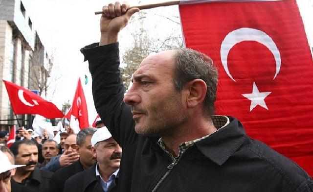 Members of a pro-government workers union protest