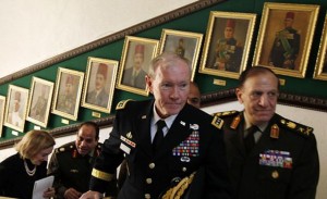 U.S. Chairman of the Joint Chiefs of Staff General Martin Dempsey (front) walks next to Lieutenant General Sami Anan (right) Egypt’s armed forces chief of staf