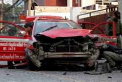 Bangkok police inspect blown-up taxi