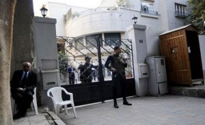 Egyptian soldiers stand guard in front of the U.S. National Democratic Institute