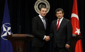 NATO Secretary-General Anders Fogh Rasmussen (L) and Turkey's Foreign Minister Ahmet Davutoglu