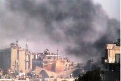Smoke rises from Syrian shelling of Homs