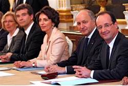 Hollande R seated with his newly appointed ministers