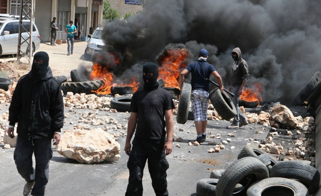 Street battles between pro- and anti-Syrian groups in Beirut (Reuters)