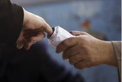 Voter has finger inked after casting ballot Reuters