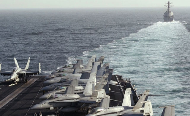 The Sterett Destroyer escorts the Nimitz-class aircraft carrier USS Abraham Lincoln CVN 72 Reuters