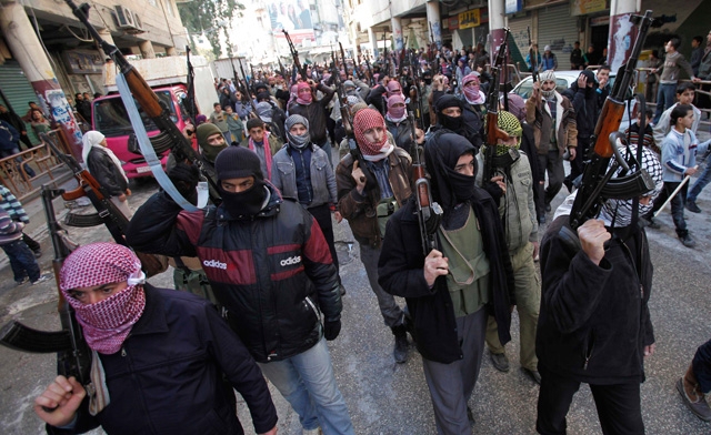 jihadists in Syria has accelerated due to a convergence with the sectarian tensions across the countrys border with Iraq. AP