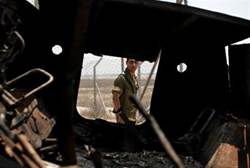 a burned Egyptian military vehicle that was seized by Islamist gunmen Reuters