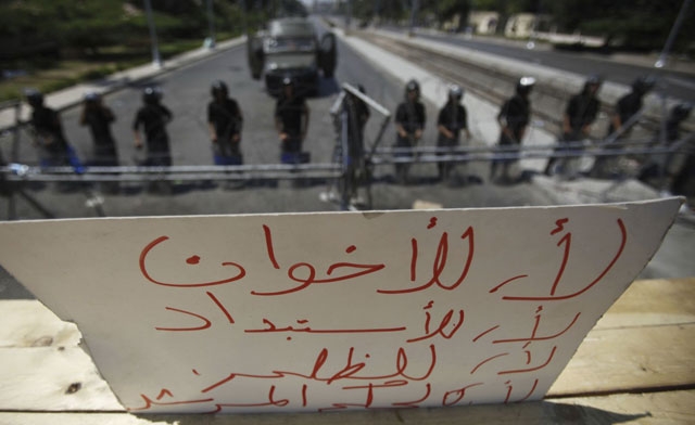 a sign placed by protesters against Muslim brotherhood in Cairo. Reuters