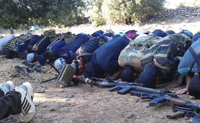 Members of the Free Syrian Army perform prayers in Damascus Reuters