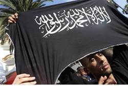 Protester holds Islamist flag at US Consulate in Casablanca - Reuters
