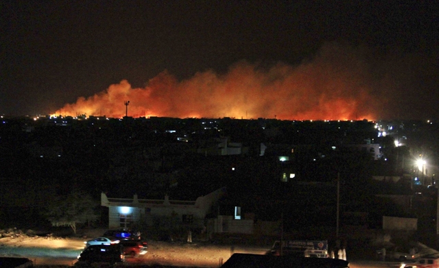 One explosion sent detonating ammunition flying through the air and causing panic Reuters