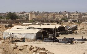 Palestinians collect concrete metal that were smuggled through tunnels beneath the Egyptian-Gaza border in Rafah