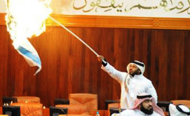 Bahraini lawmaker Osama Al-Tamimi torches the Jewish states flag in parliament. Gulf News
