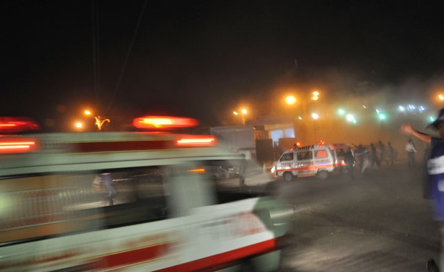 Rescue workers and ambulances are seen at the site - Reuters