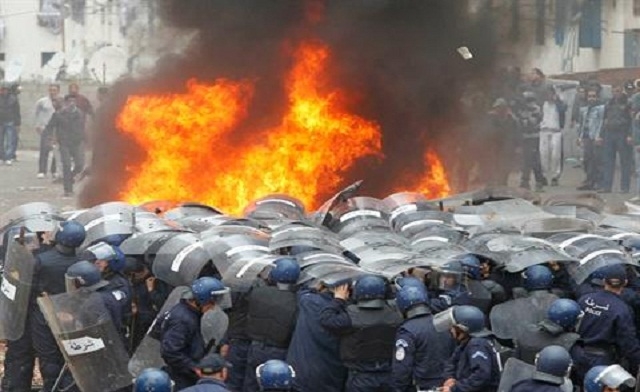 Algeria. Riot police confront protesters during last years clashes in Algeria. Reuters