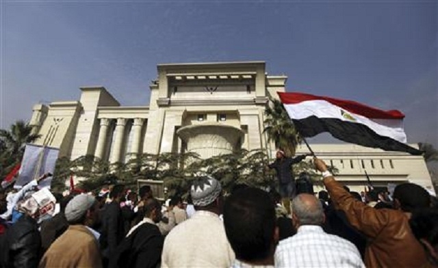 Supporters of Egyptian President Mohamed Mursi shout slogans in front of the Supreme Constitutional Court in Maadi south of Cairo December 2 2012. Reuters