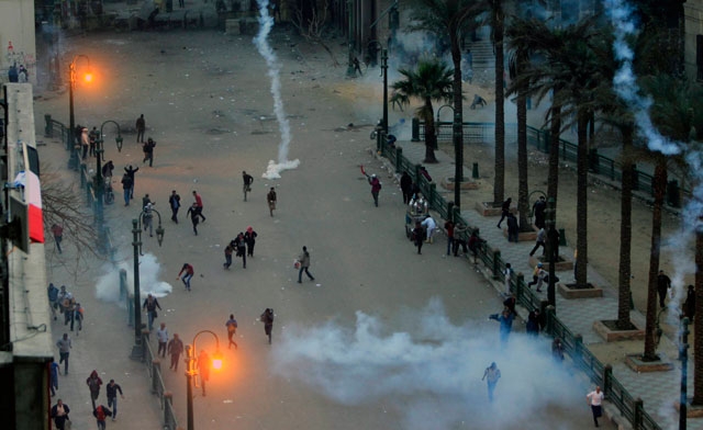 Protesters flee from tear gas Reuters