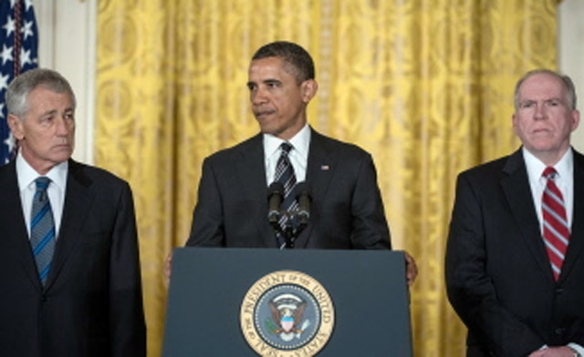 US President Barack Obama C new CIA Director Johhn BrennanR and Defense Secretary Chuck HagelL AFP