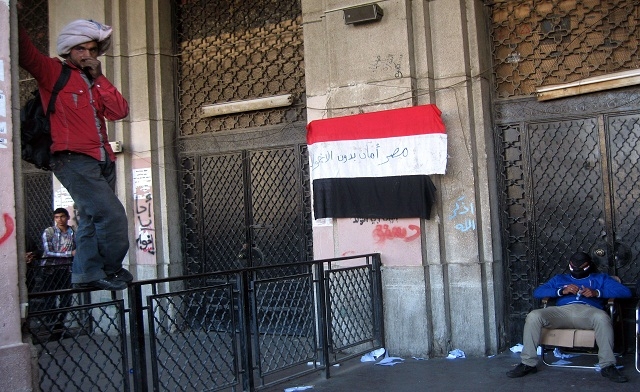 a national flag on which is written in Arabic Egypt is moor safe without Muslim Brotherhoods -AFP