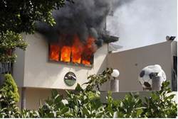 Flames rise from the headquarters of the Egyptian Football Association in Cairo - AFP