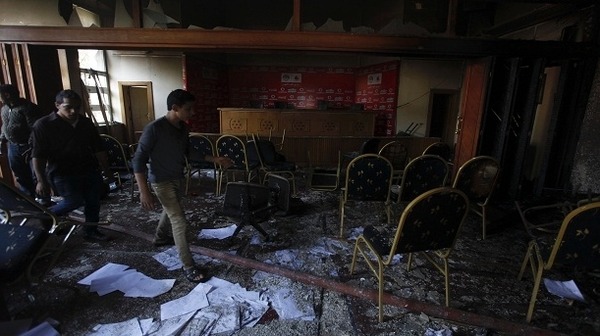 People inspect the damage at the Egyptian Soccer Federation Reuters