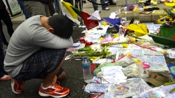 People-visit-a-make-shift-memorial-in-Boston