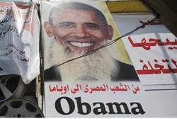 Poster accuses Obama of helping Islamists Reuters