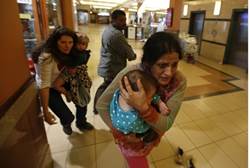 Women and children run for cover - Reuters