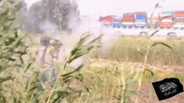 twoterrorists firing RPGs at ship transiting Suez Canal