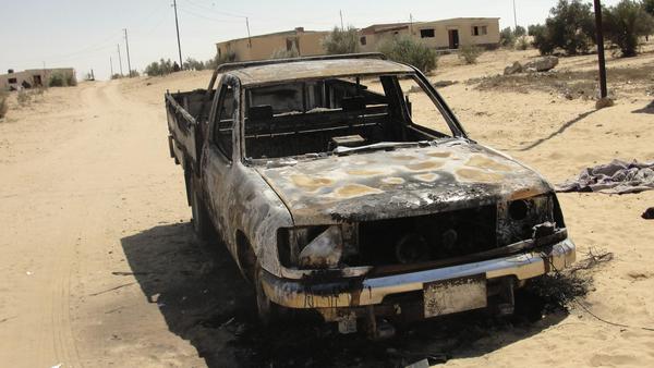 wreckage of a burnt car of militant targets in Sinai peninsula Reuters