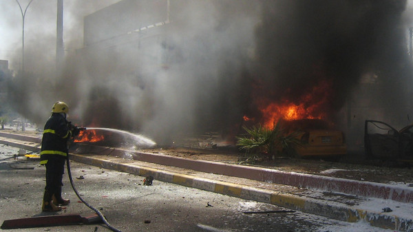 A fire at the site of a car bomb attack in the city of Kirkuk AFP