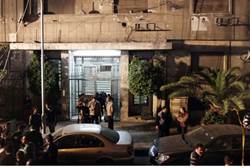 Investigators gather in front of the Israeli embassy in Cairo - Reuters