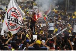 Members of the Muslim Brotherhood shout slogans during a protest in Cairo