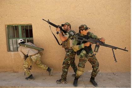 Shia militiamen battling ISIS in Iraq file - Reuters