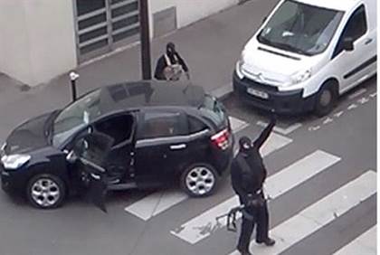 Terrorist gestures after Charlie Hebdo attack - Reuters