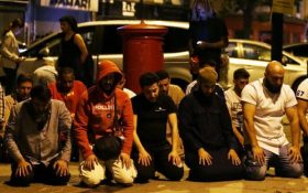 Praying in London street.